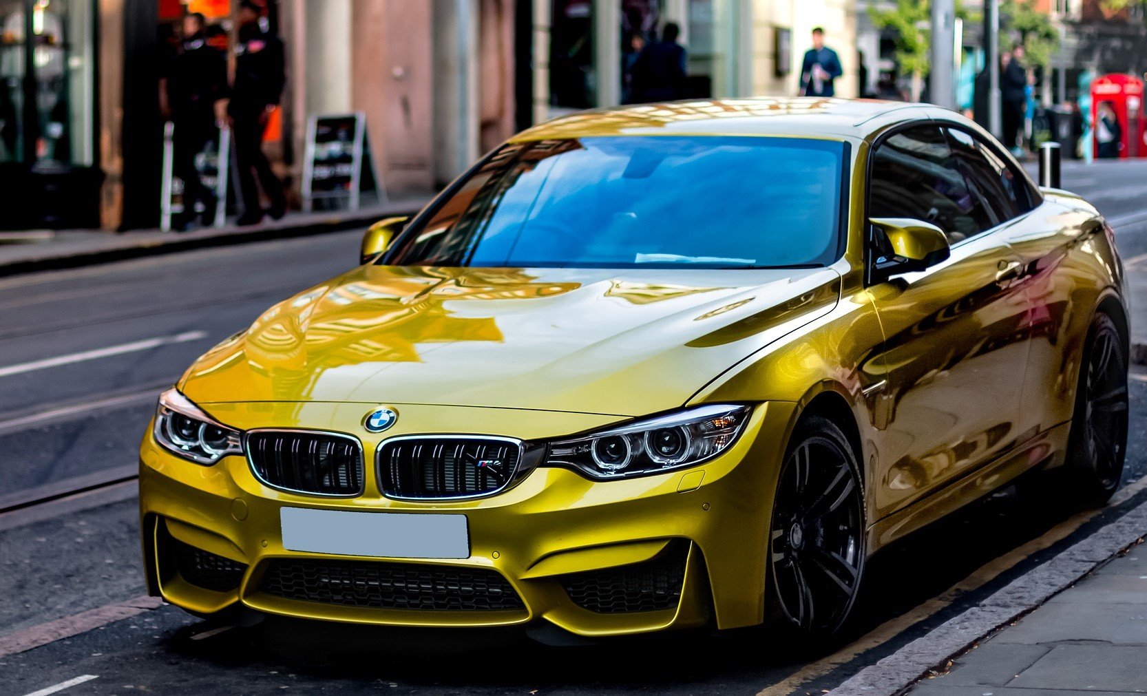 Yellow BMW on a Street | Veteran Car Donations