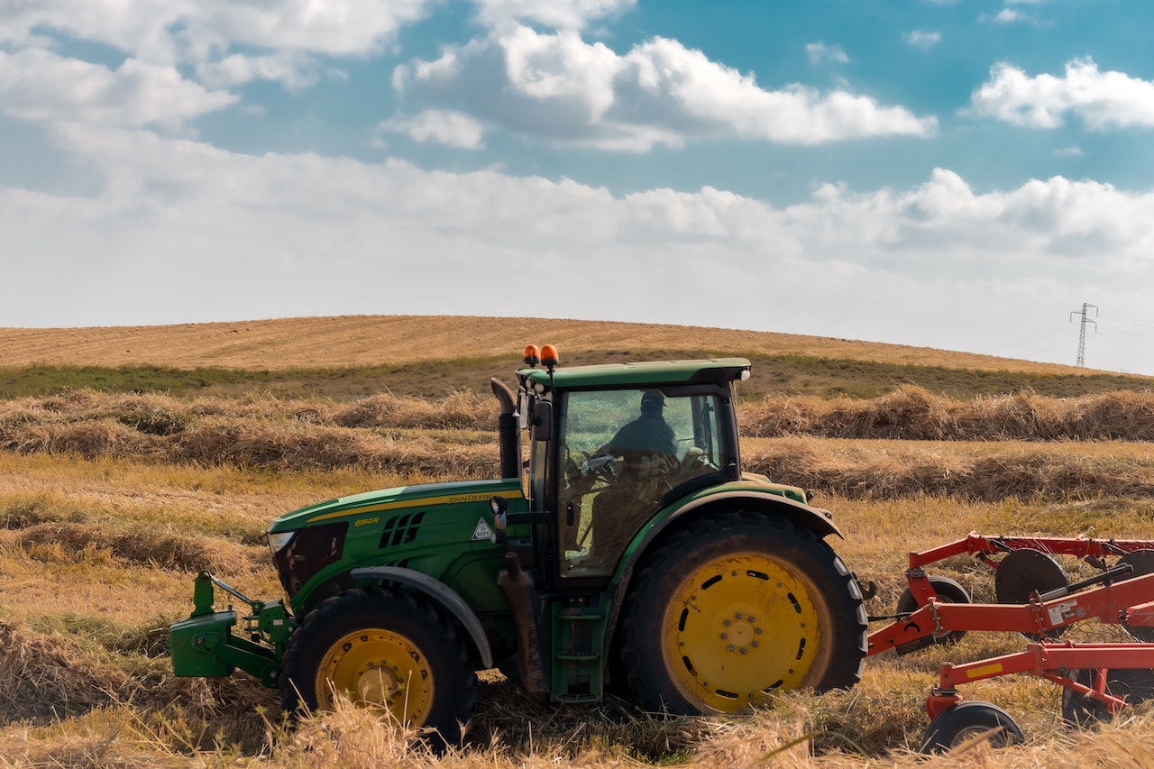 Green Tractor on Field | Veteran Car Donations