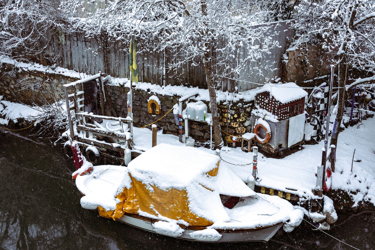 Docked Boat Covered in Snow | Veteran Car Donations