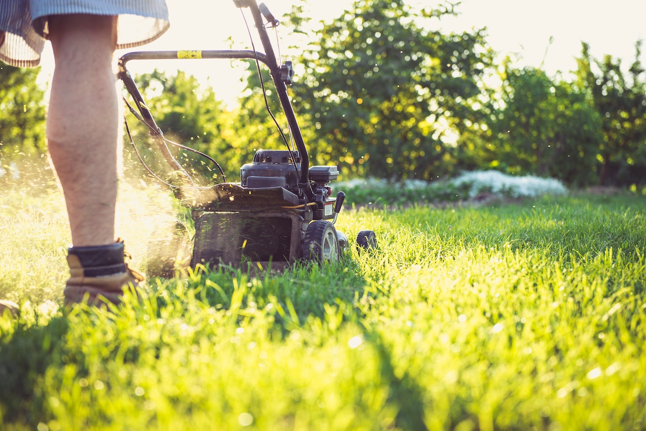 Man Mowing Lawn | Veteran Car Donations