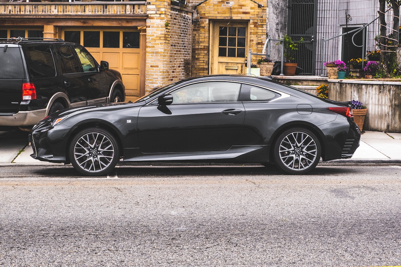 Black Coupe Parked on a Roadside | Veteran Car Donations