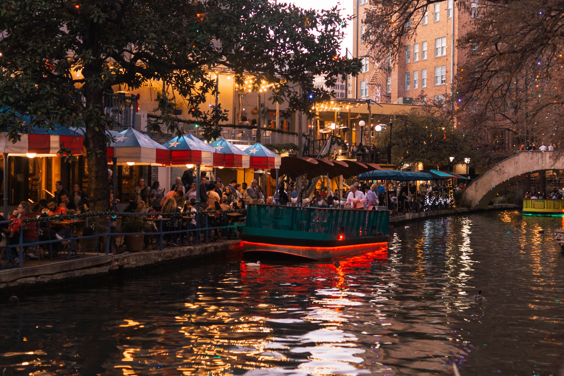 People Sitting Beside The lake in The Alamo San Antonio | Veteran Car Donations