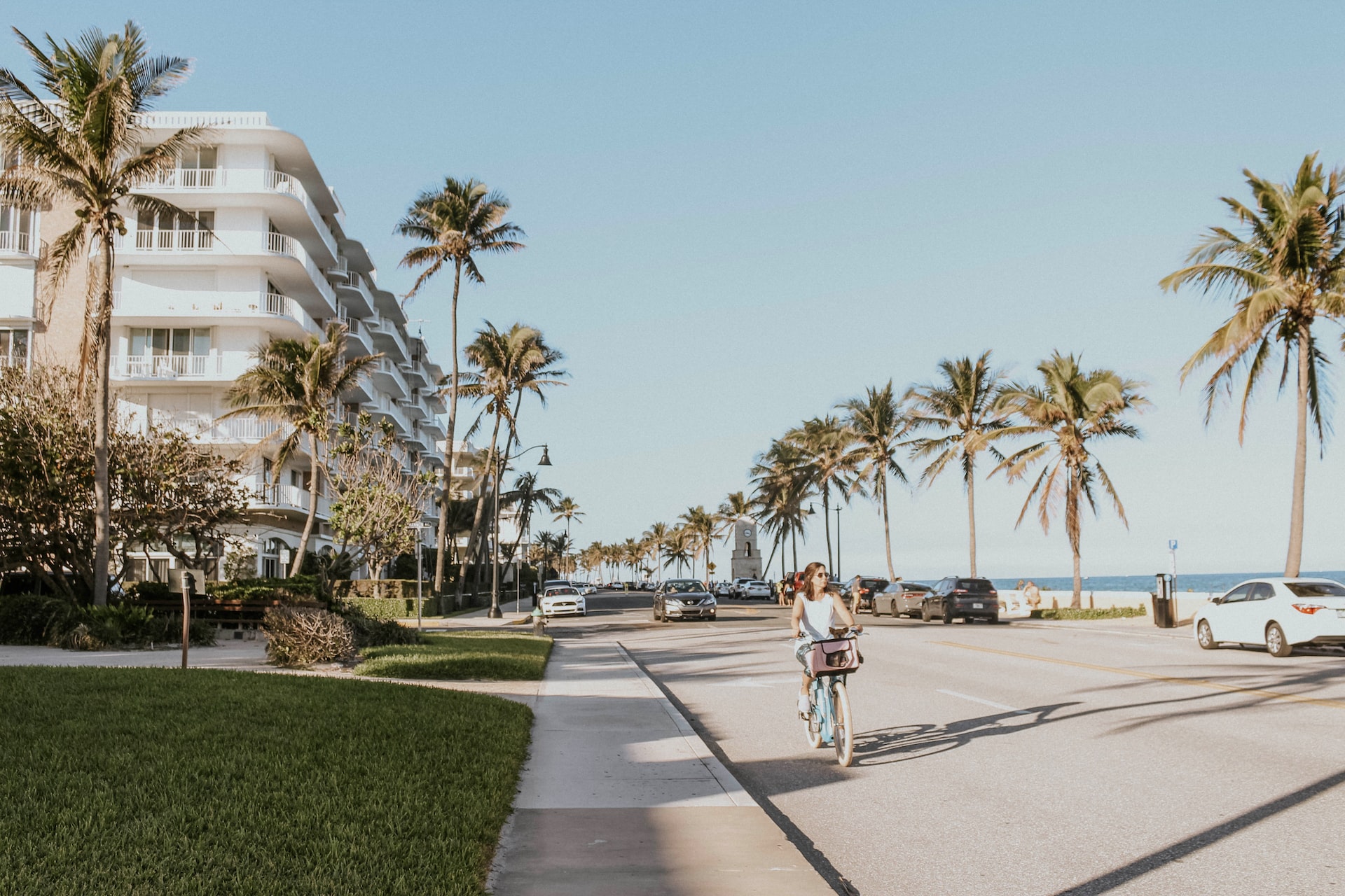 Woman on a bike in Palm Beach | Veteran Car Donations