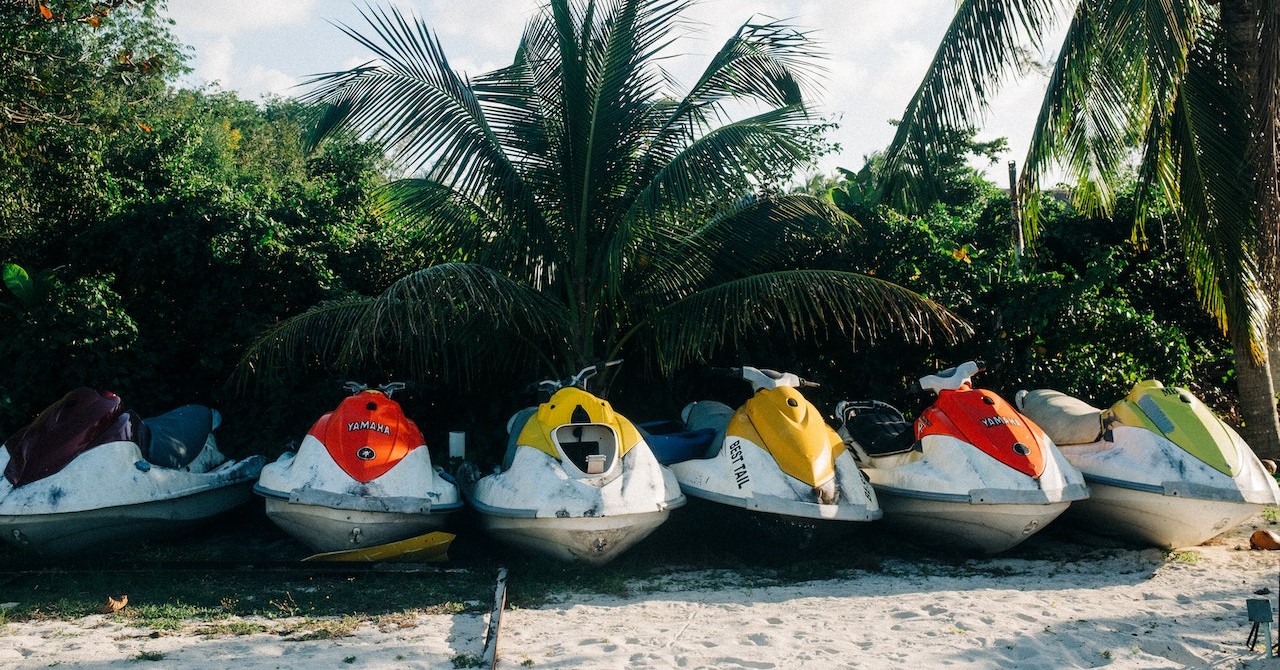 Parked jet skis in the beach | Veteran Car Donations