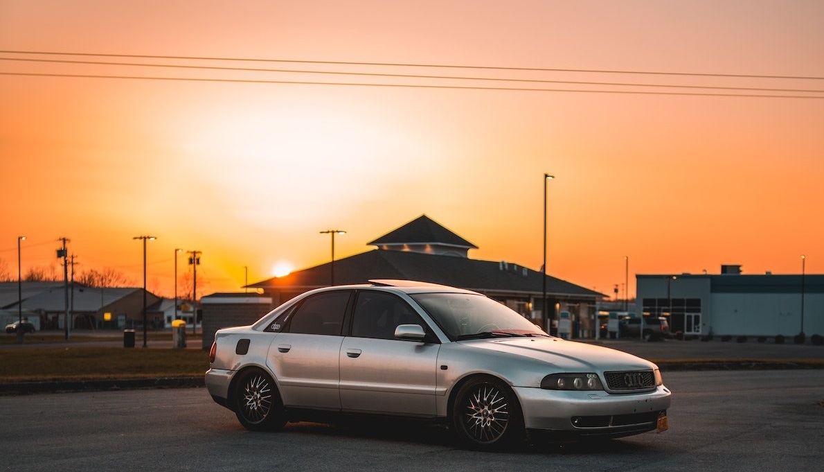 A parked Silver Sedan during Sunset | Veteran Car Donations