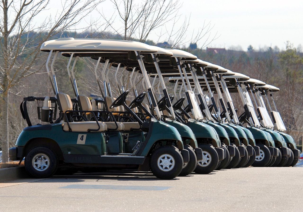 Green Golf Cart Parked | Veteran Car Donations