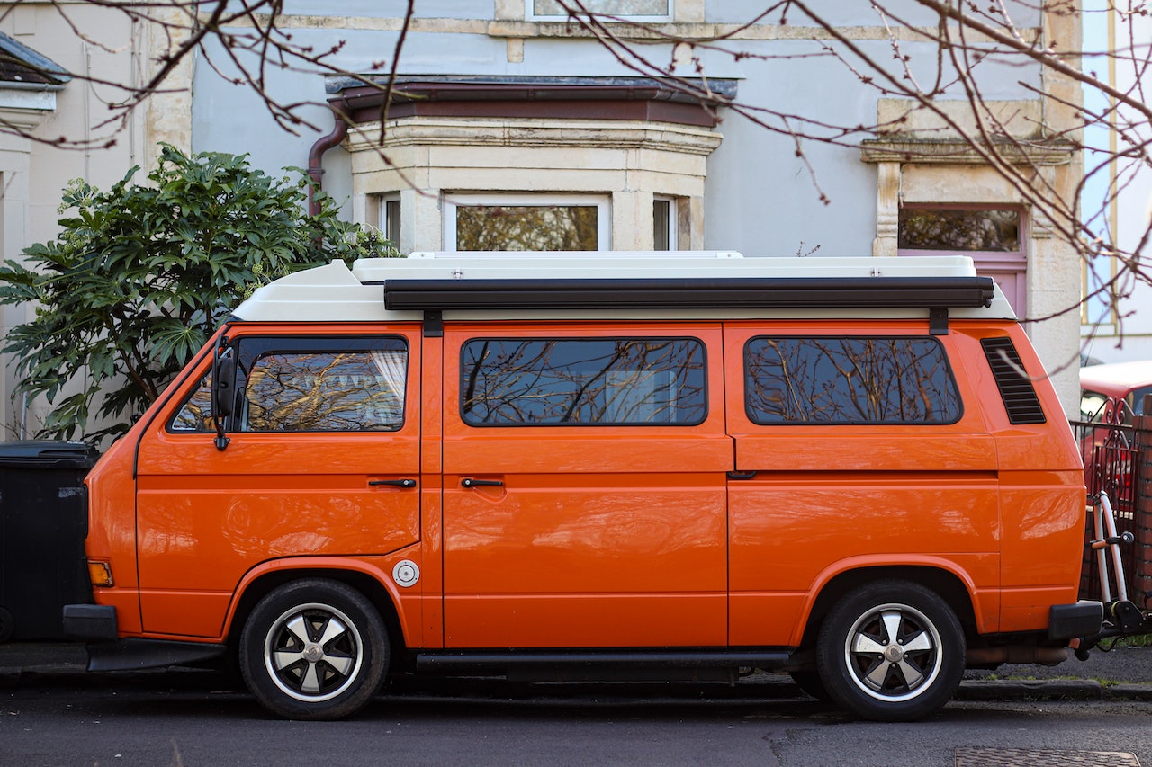 Orange Van Parked Near Green Tree | Veteran Car Donations