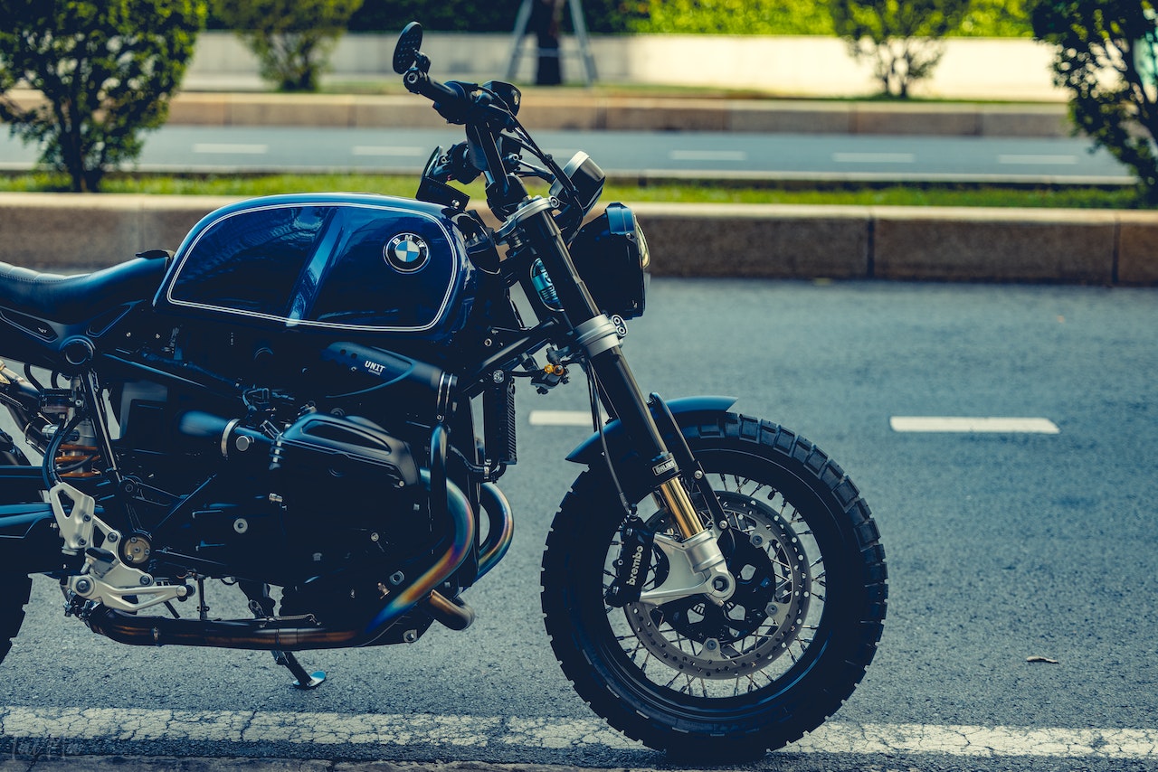 A Black Cruiser BMW Motorcycle Parked on the Roadside | Veteran Car Donations