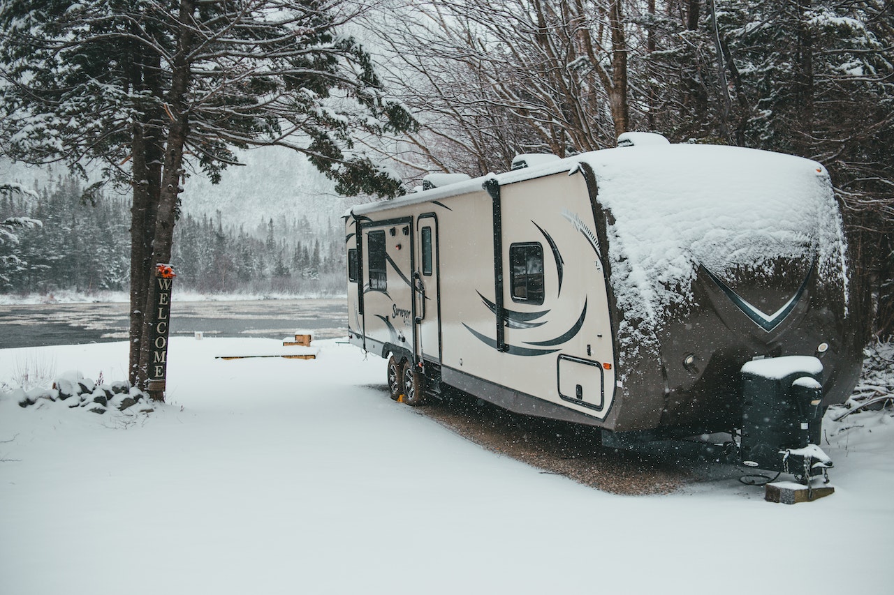 RV trailer parked in snow | Veteran Car Donations