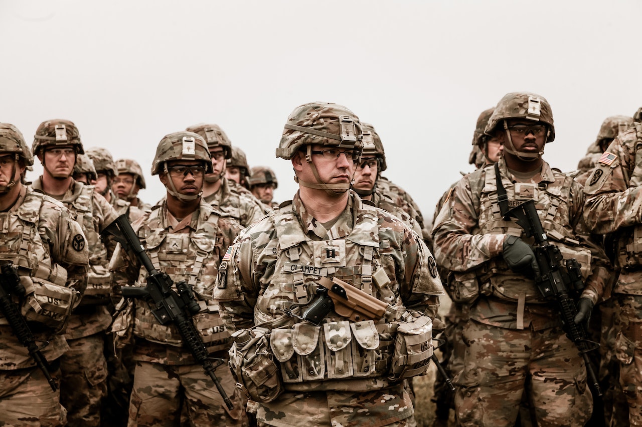 A Group of Soldiers Holding Rifles | Veteran Car Donations