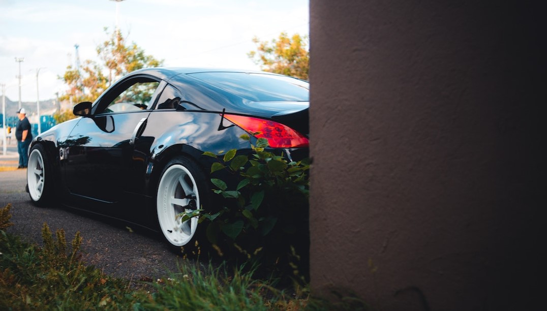 Black Sports Car Parked by a Brown Wall | Veteran Car Donations