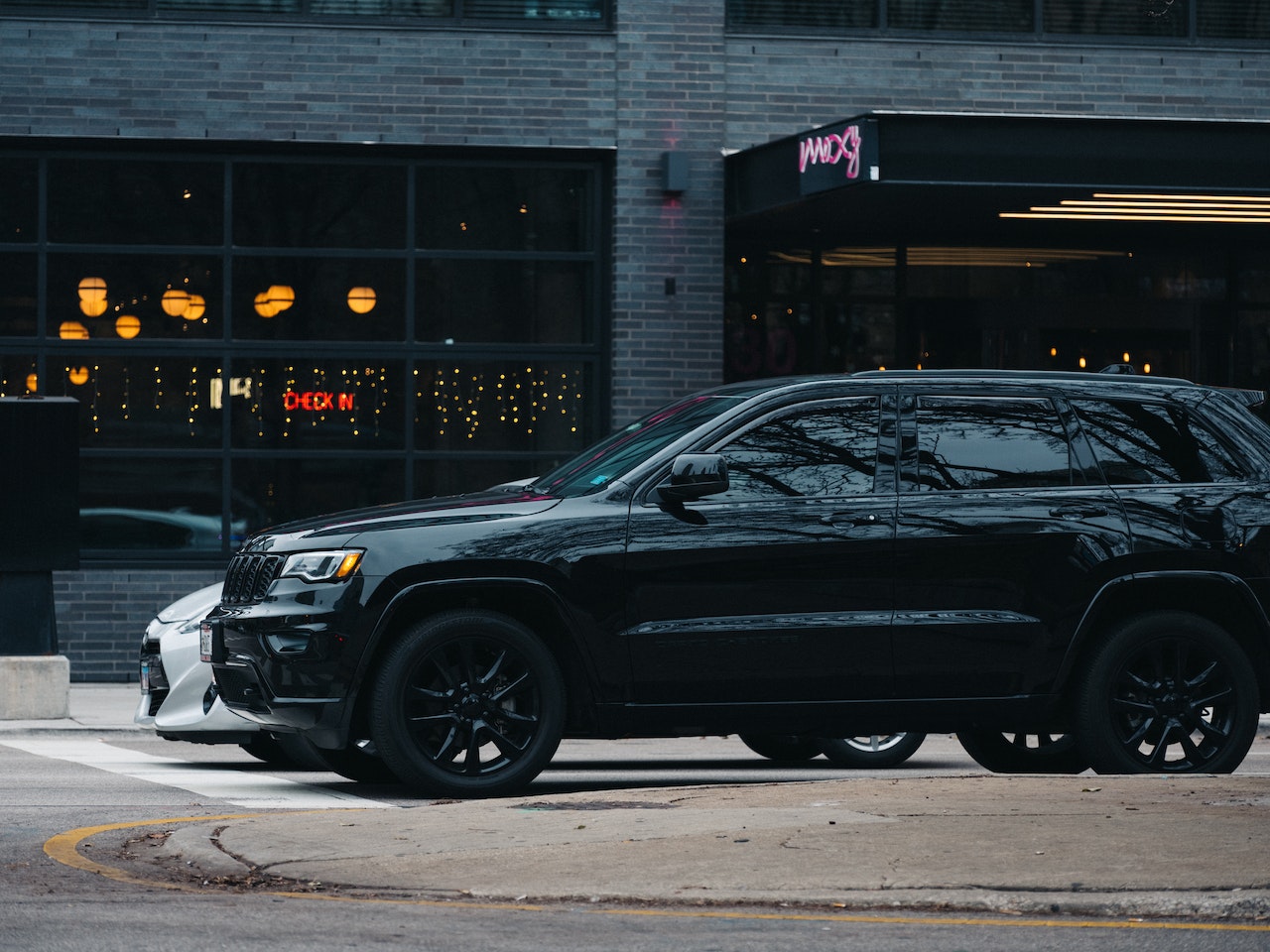 Black Suv Beside a White Car | Veteran Car Donations