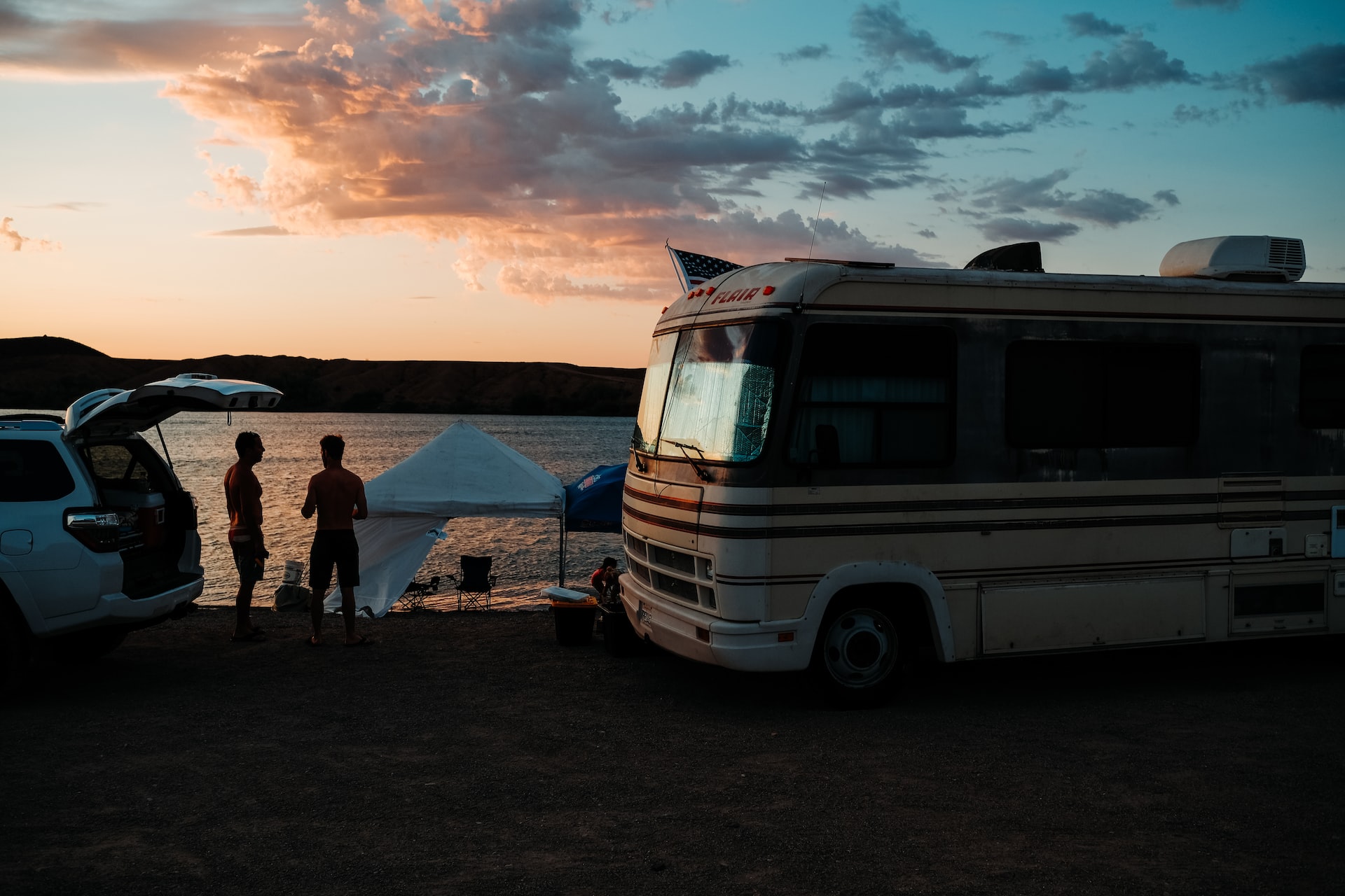 Class A motorhome parked on a lake | Veteran Car Donations