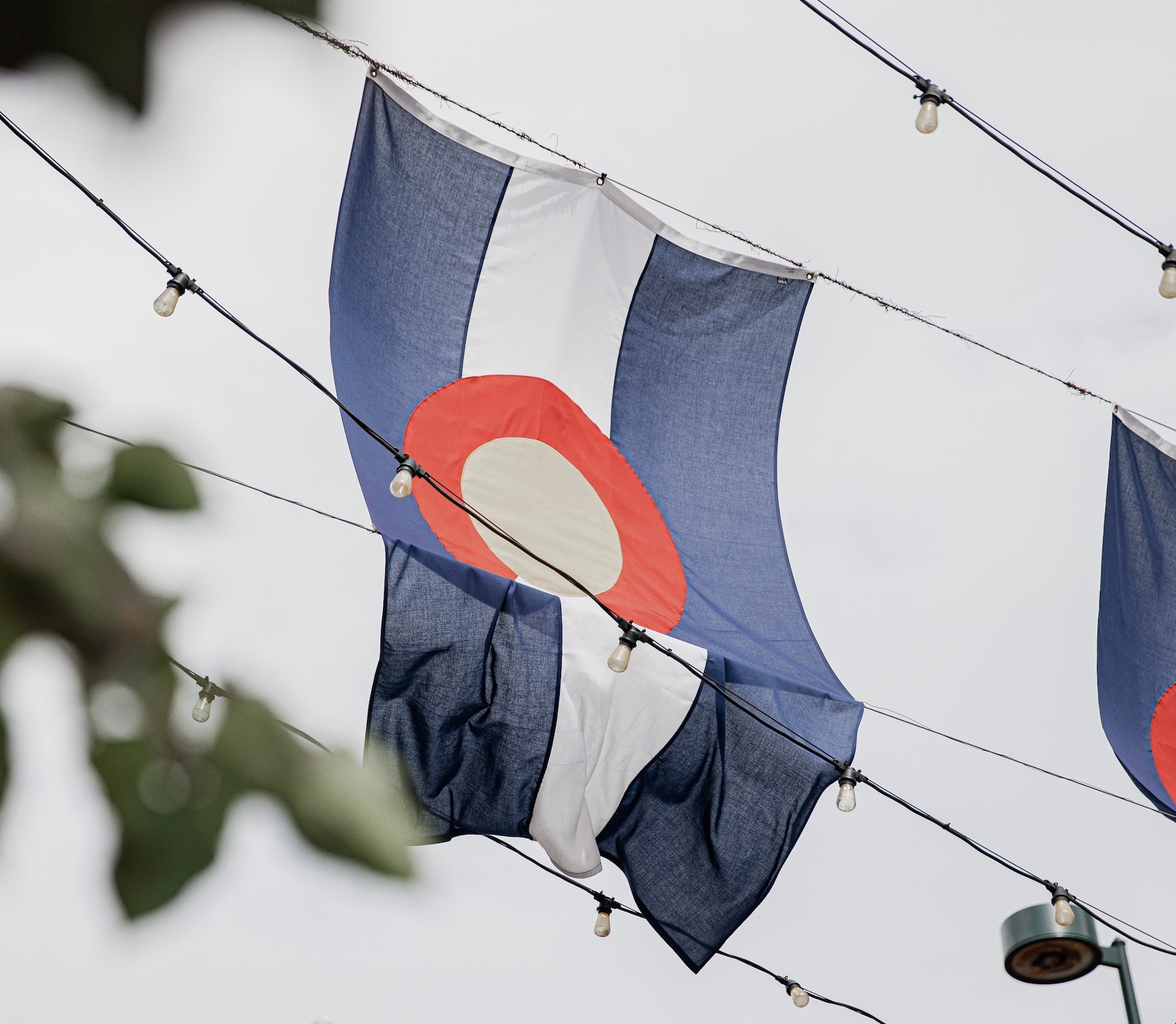 Colorado Flag hanging on the street | Veteran Car Donations