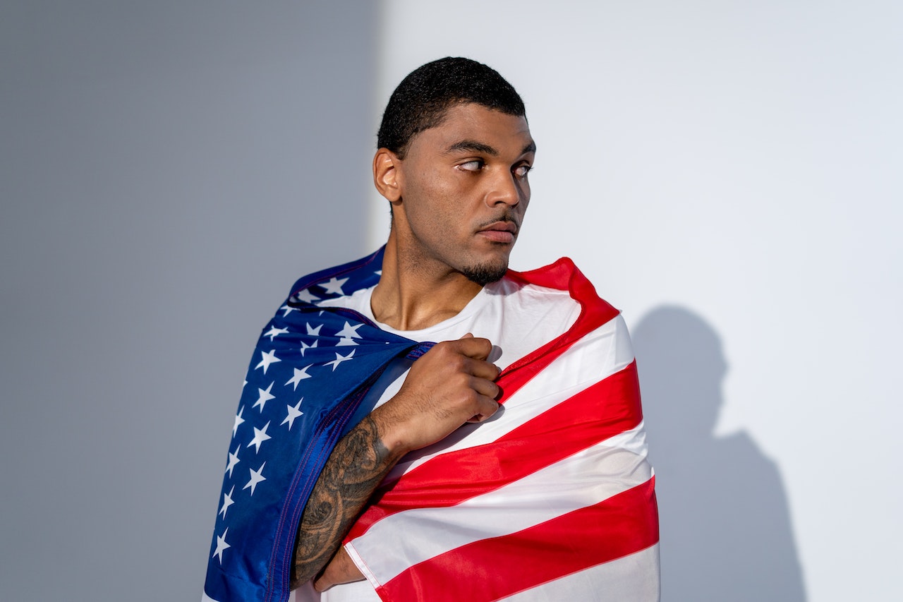 Man With US Flag | Veteran Car Donations