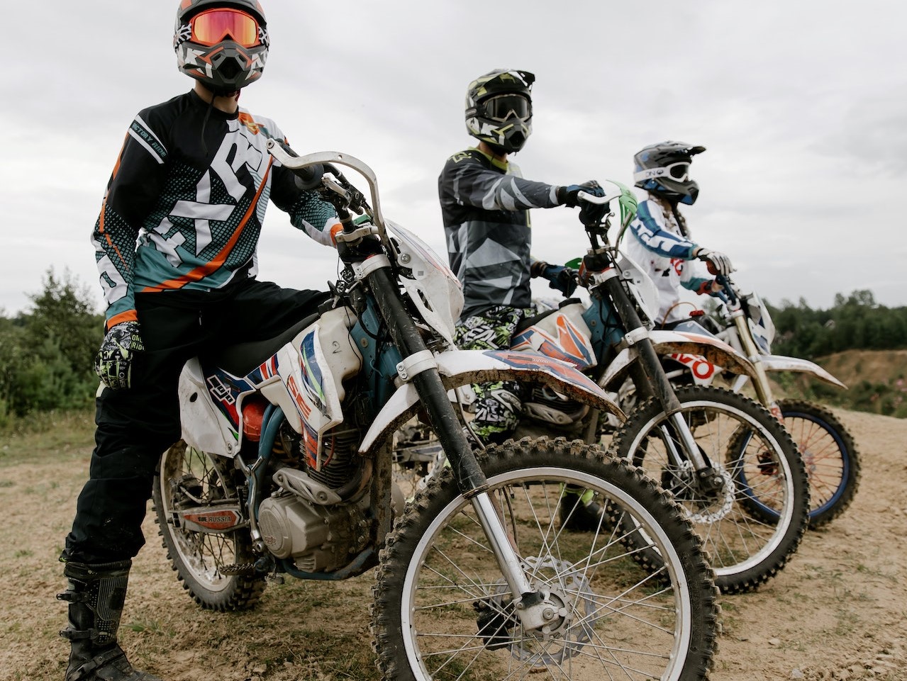 Men Riding Dirt Bikes | Veteran Car Donations
