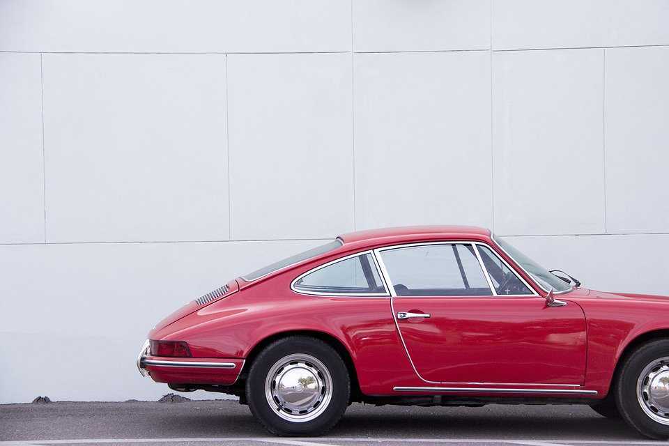 Red Oldtime Car on a Street | Veteran Car Donations