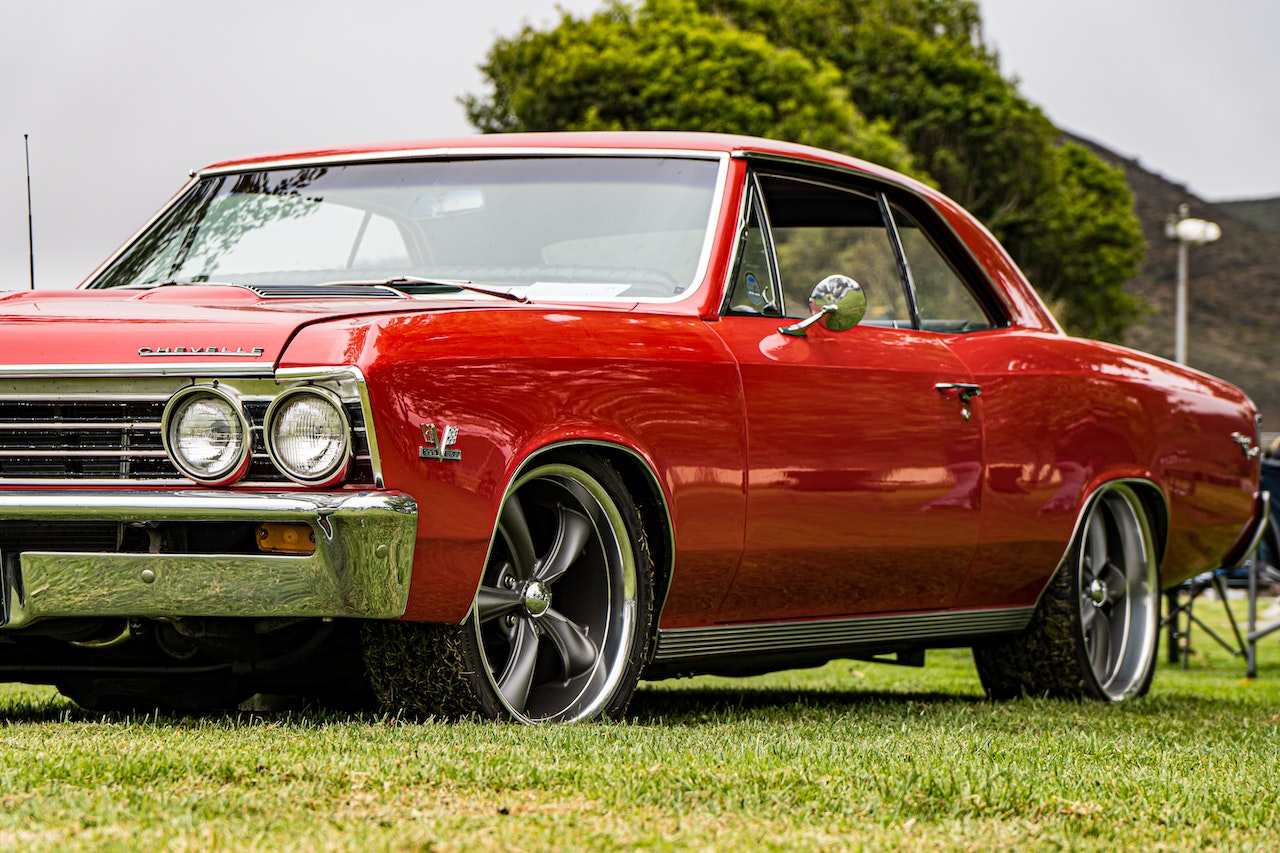 Red Chevelle Car on Grass Field | Veteran Car Donations