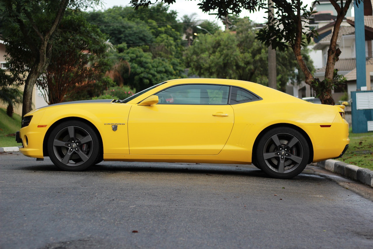 Side View of a Yellow Camaro | Veteran Car Donations