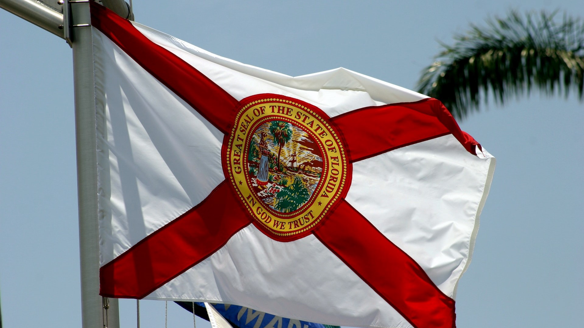 The state flag of Florida flies on a ship's mast | Veteran Car Donations