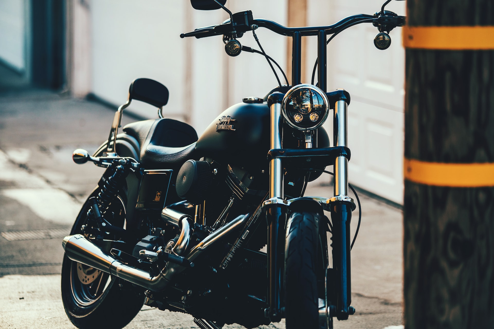 black cruiser motorcycle near black street post photo | Veteran Car Donations