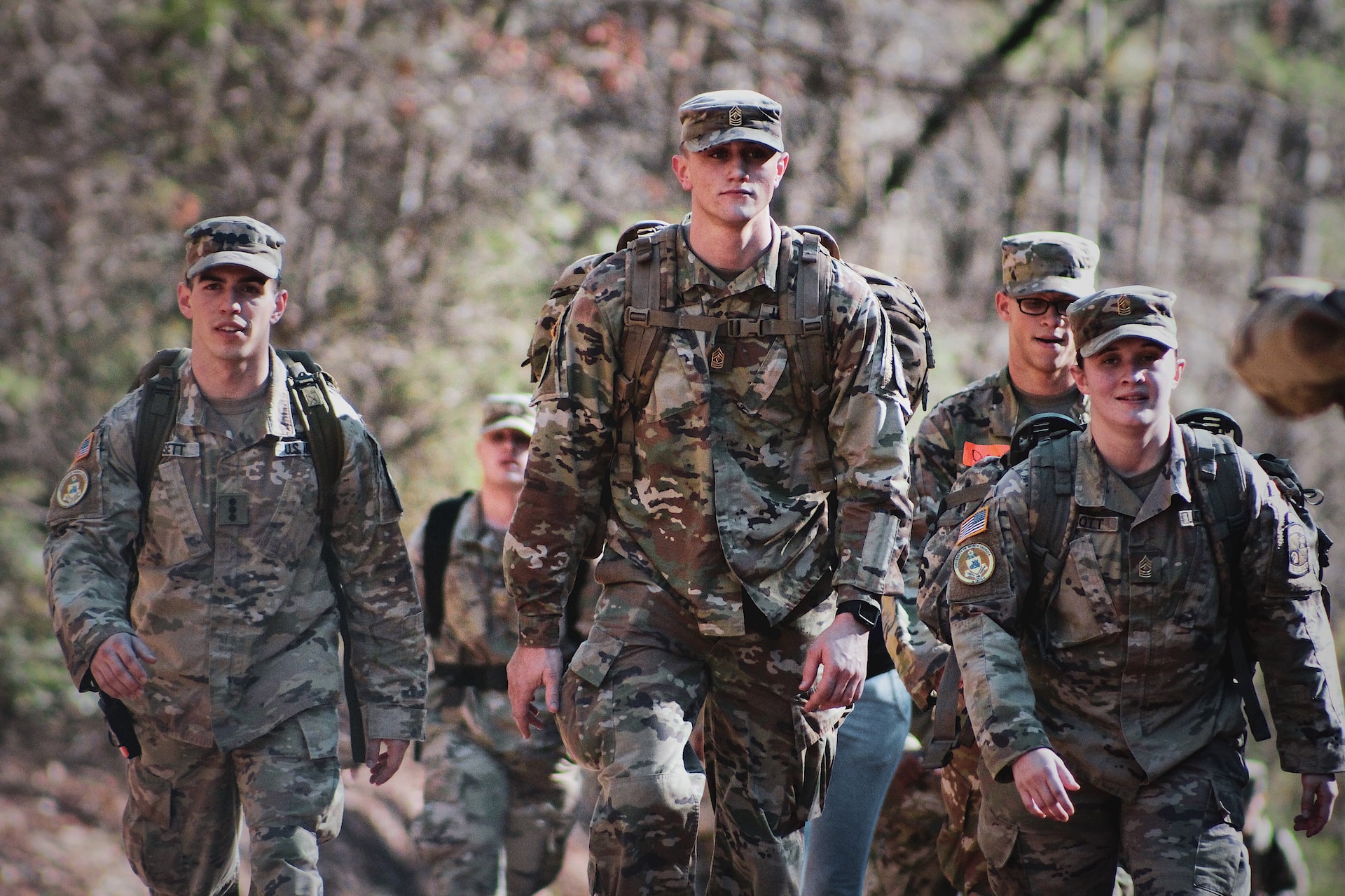 men in camouflage uniform standing on field during daytime | Veteran Car Donations