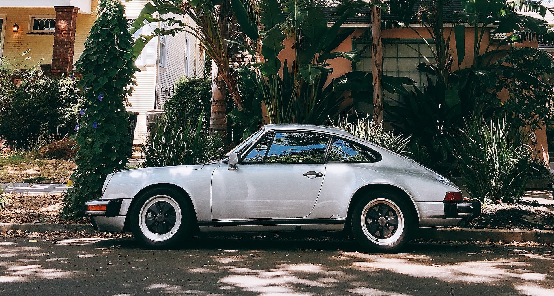 white coupe on gray concrete ground | Veteran Car Donations