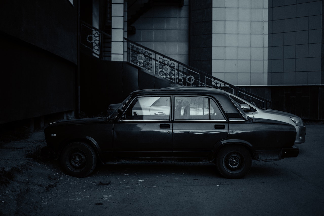 Black Sedan Parked with Another car | Veteran Car Donations