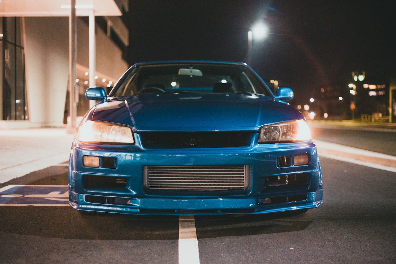 Blue Car on Parked on the Road During Night Time | Veteran Car Donations