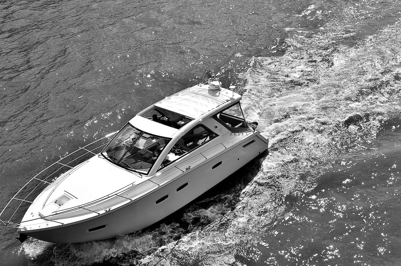 People Riding a Yacht during Daytime | Veteran Car Donations
