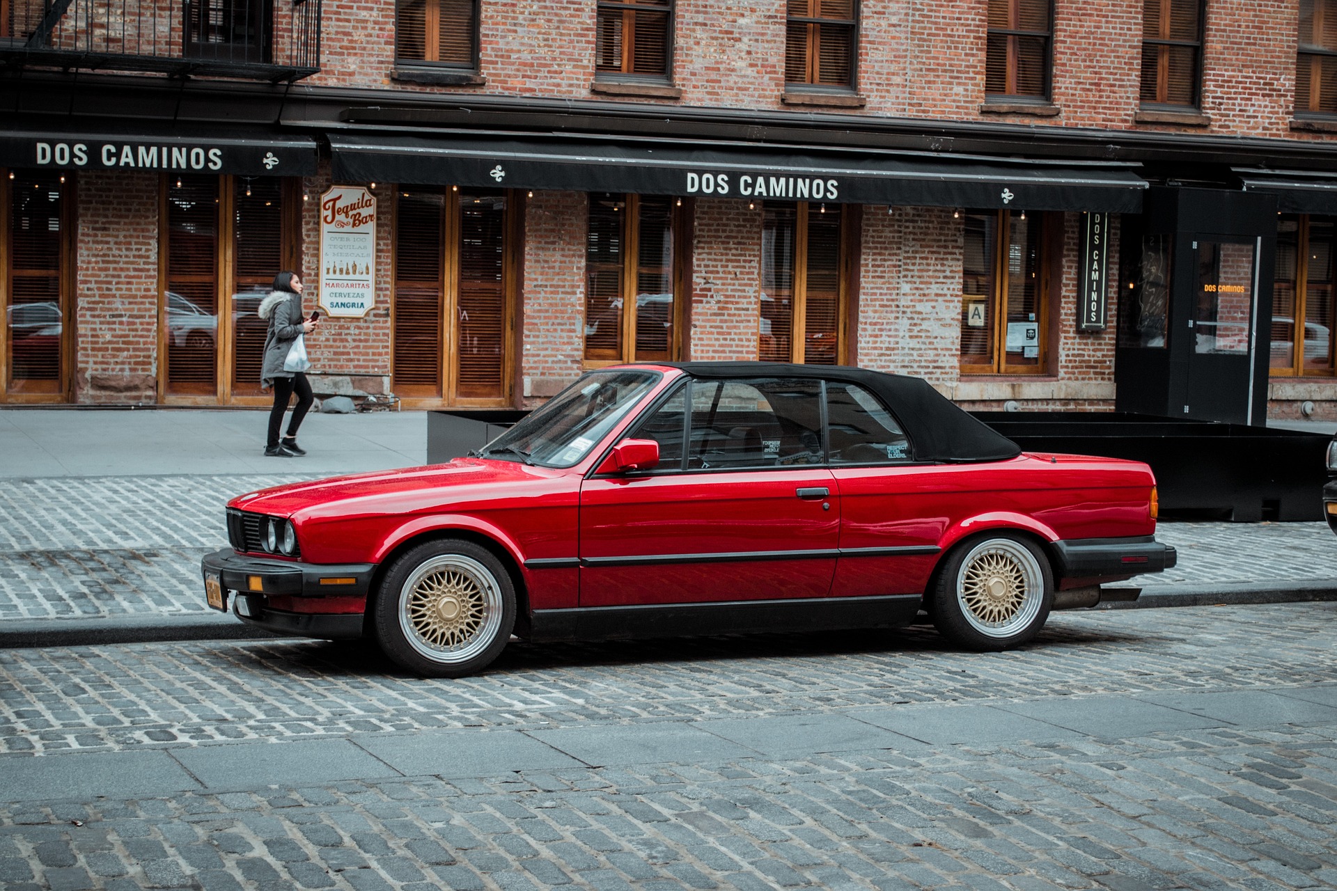 Red BMW on street | Veteran Car Donations