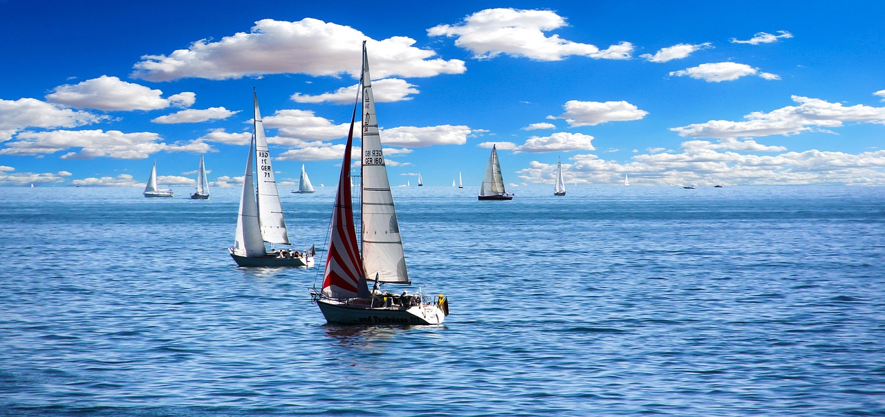 Sail Boats in the Ocean at Daytime | Veteran Car Donations