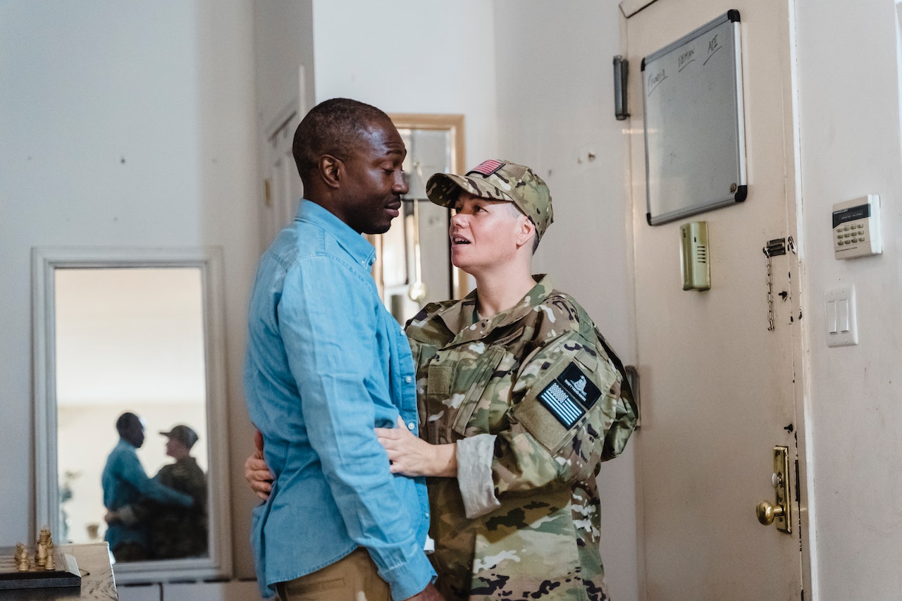 Soldier in Uniform Embracing Man | Veteran Car Donations