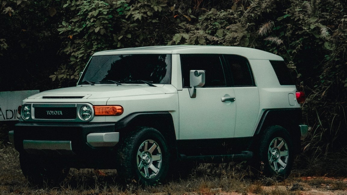 White Suv Parked Near Trees | Veteran Car Donations