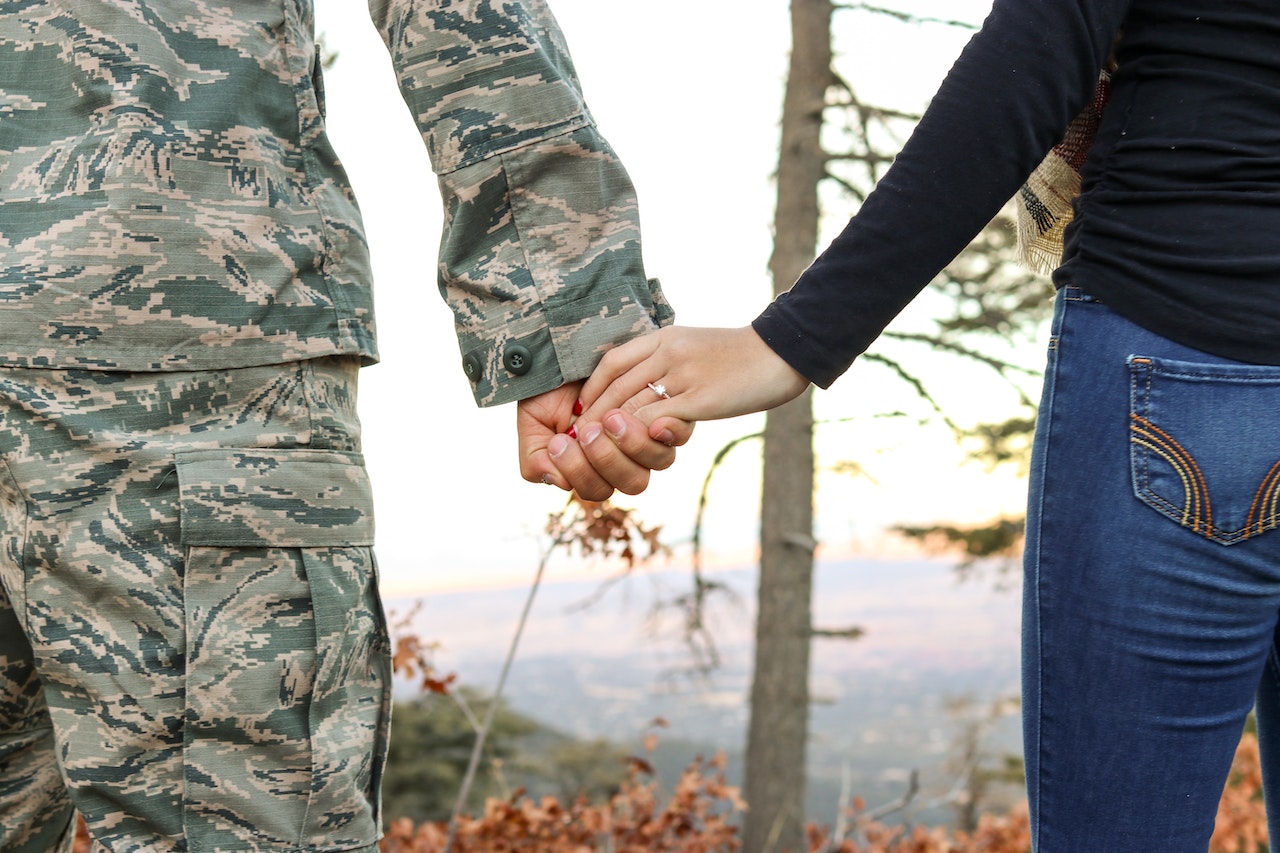 Woman Holding Man Hand | Veteran Car Donations