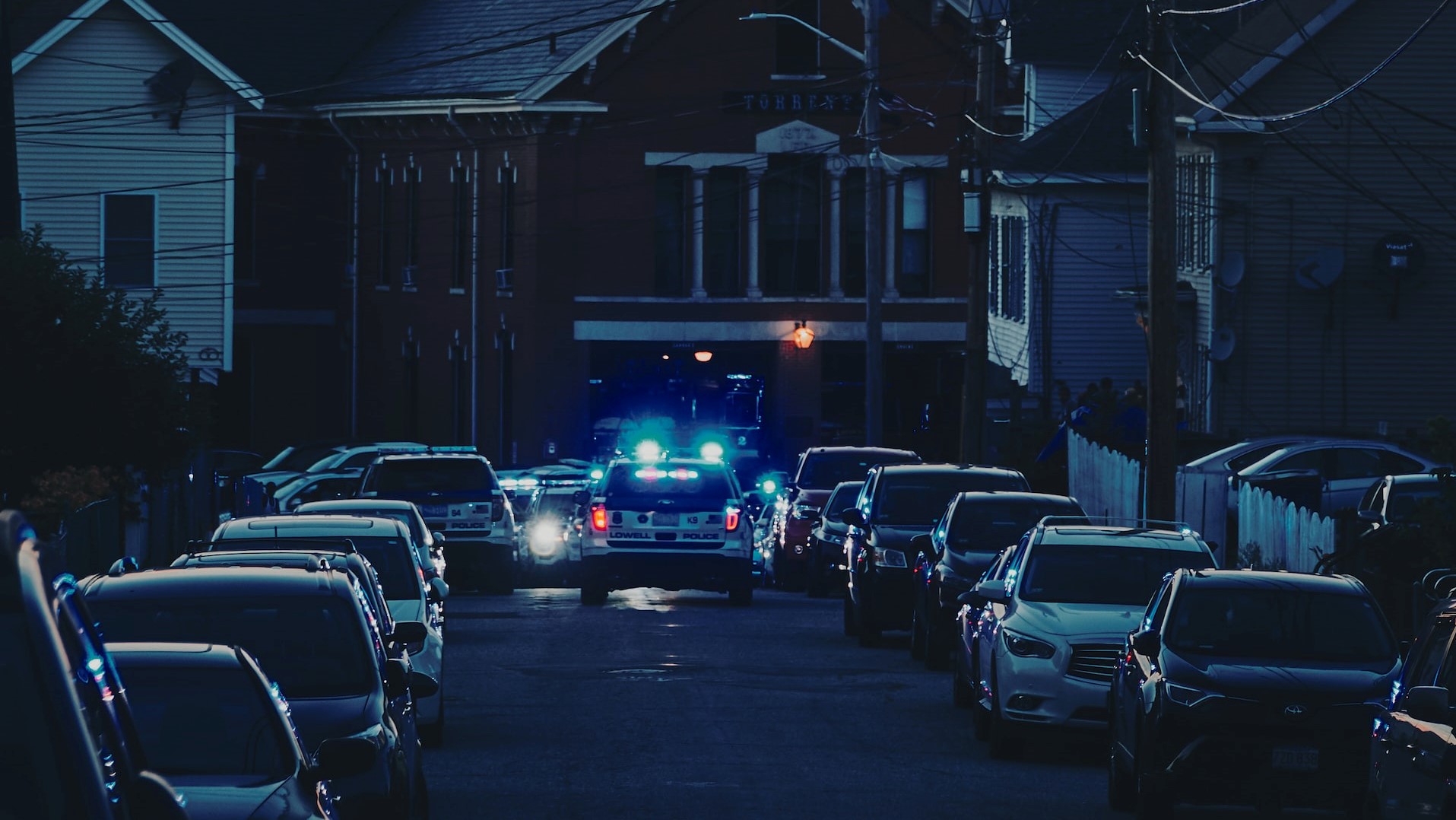 vehicles on road near house photo | Veteran Car Donations