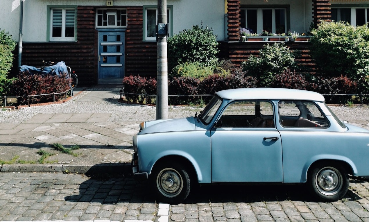 Mini Sedan Parked on Road | Veteran Car Donations