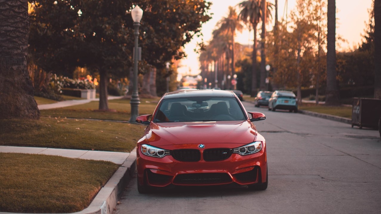 Red Car Parked on the Side of the Road | Veteran Car Donations