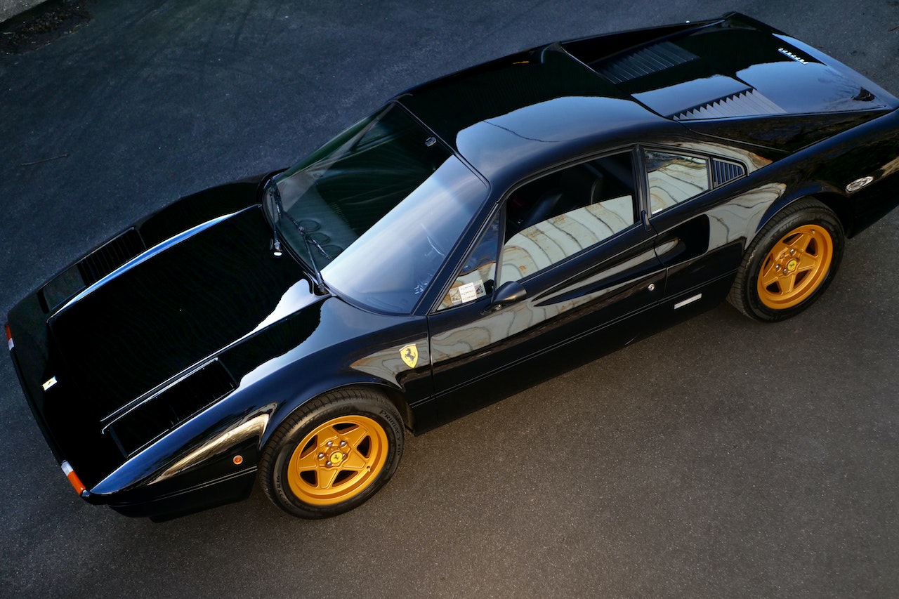 Black Coupe on Gray Surface | Veteran Car Donations