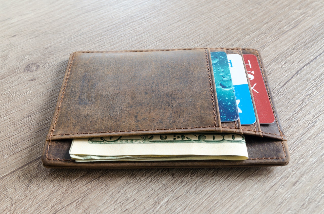 Brown Leather Wallet and Us Dollar Banknote | Veteran Car Donations
