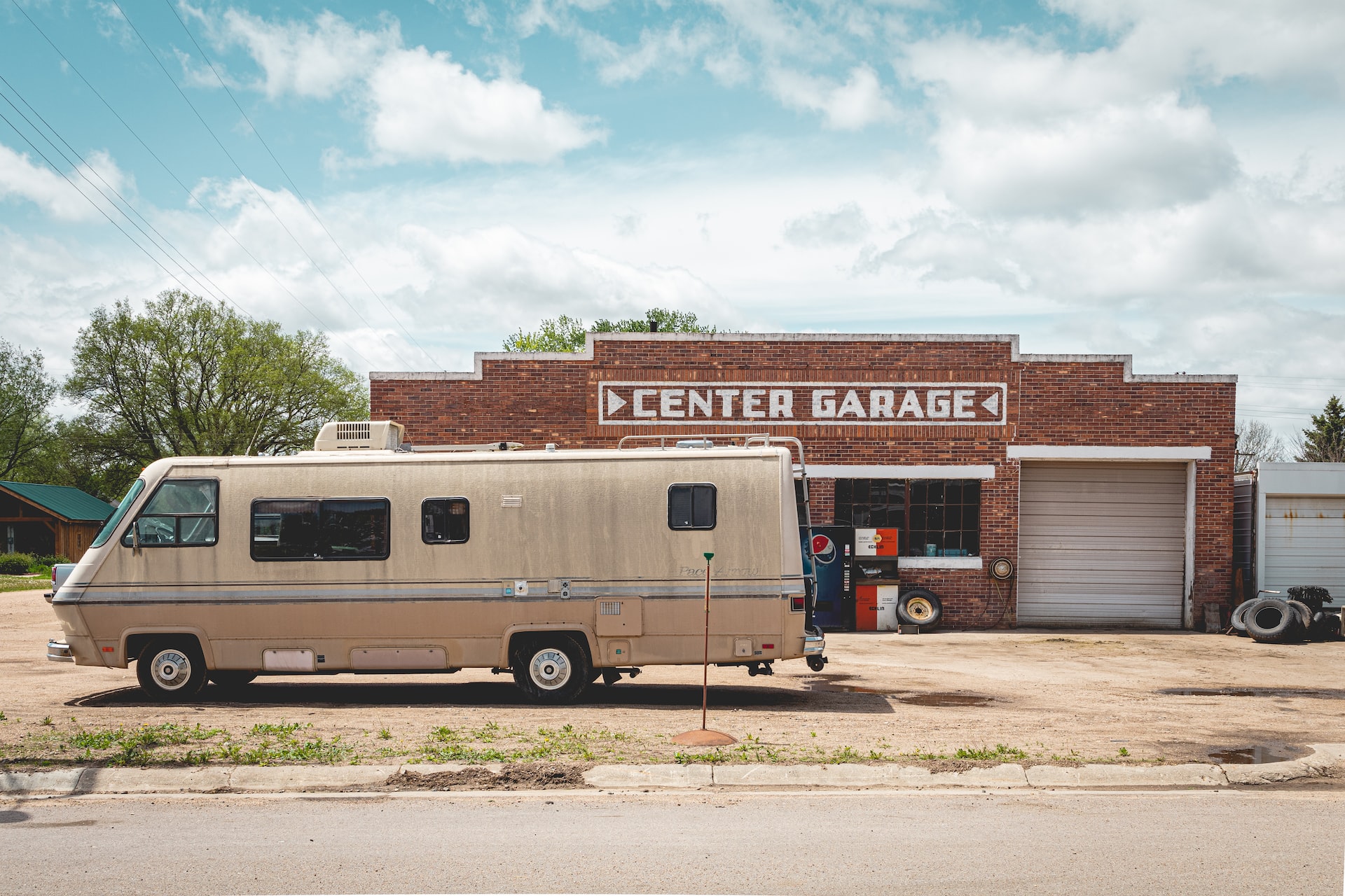 Brown Rv Parked at he Center Garage | Veteran Car Donations