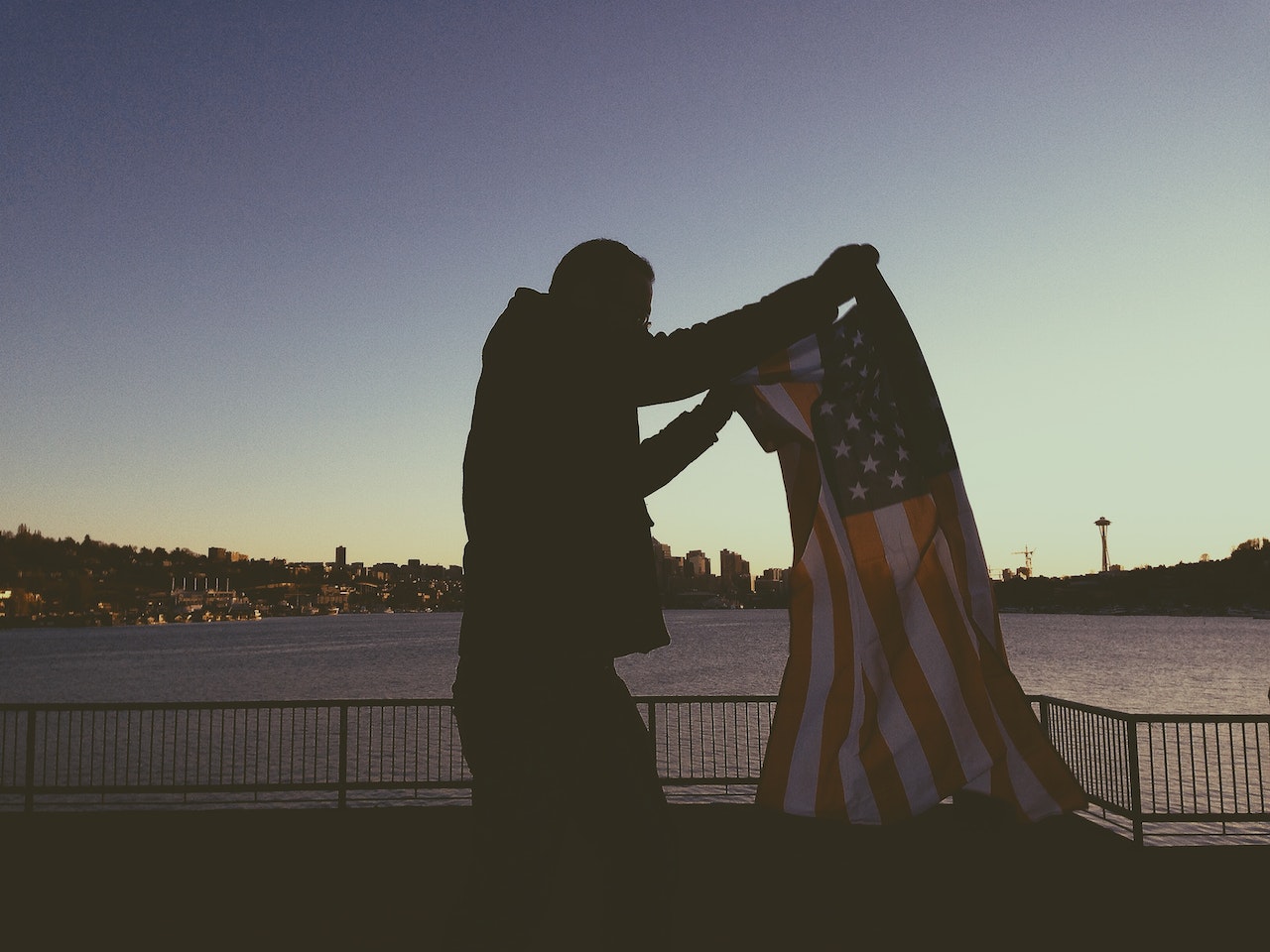 Man Holding Flag of Usa | Veteran Car Donations