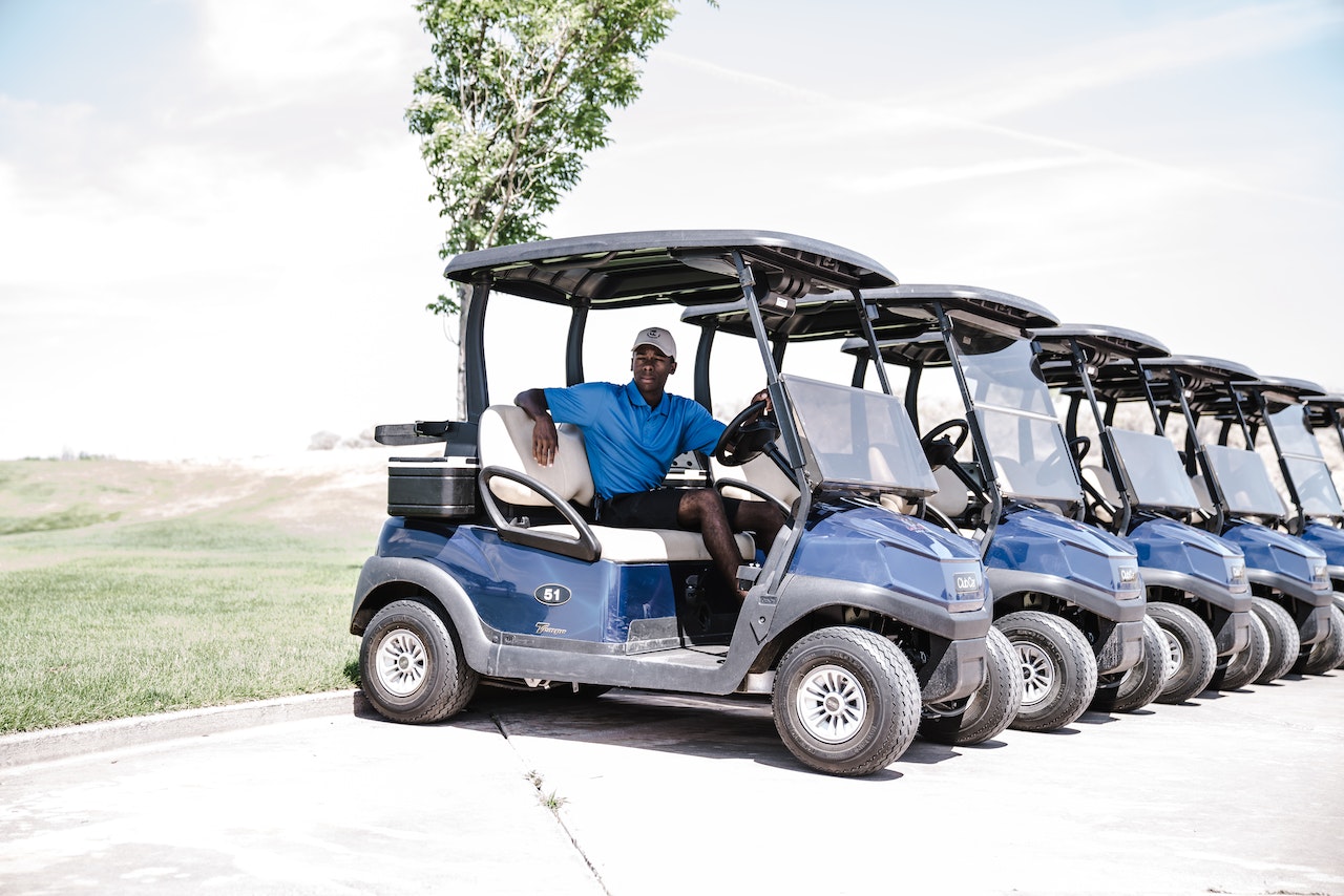 Man Riding a Golf Cart | Veteran Car Donations