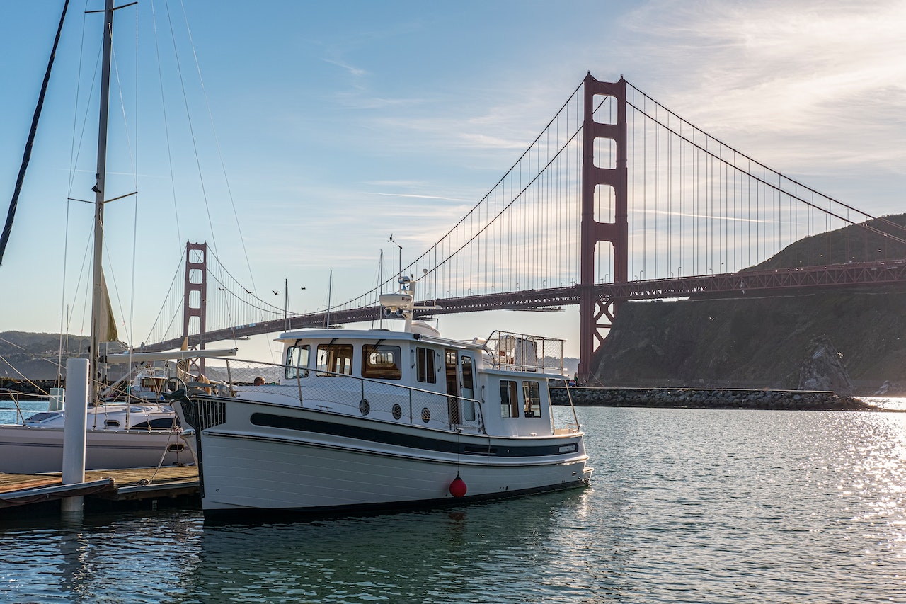 Motorboat Docked Near a Bridge | Veteran Car Donations