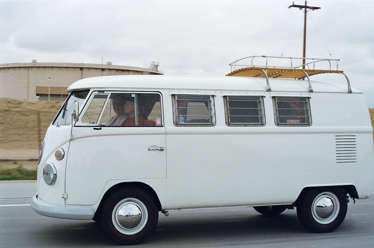 People Riding White RV During Daylight | Veteran Car Donations