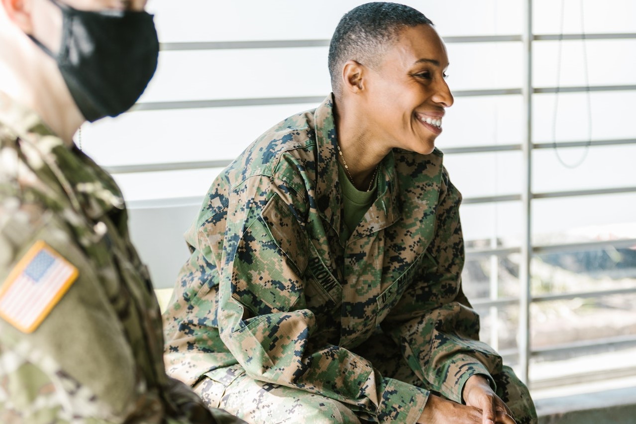 Photo of Soldiers Sitting Beside Each Other | Veteran Car Donations
