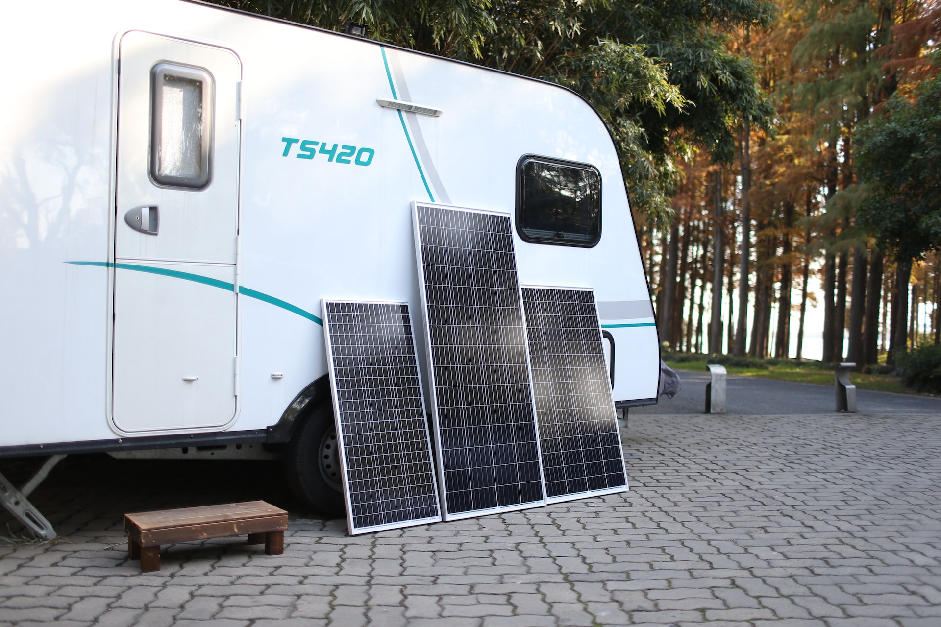 Three Solar Panel Outside of a White RV | Veteran Car Donations