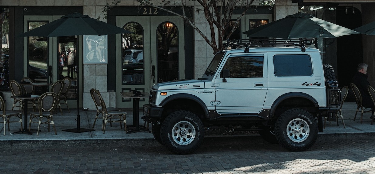 White SUV parked | Veteran Car Donations