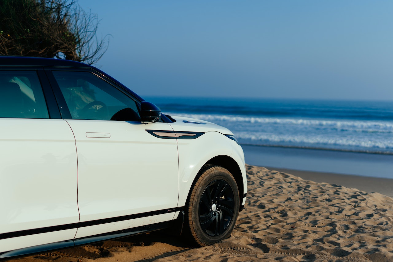 White and Black Car on Beach | Veteran Car Donations