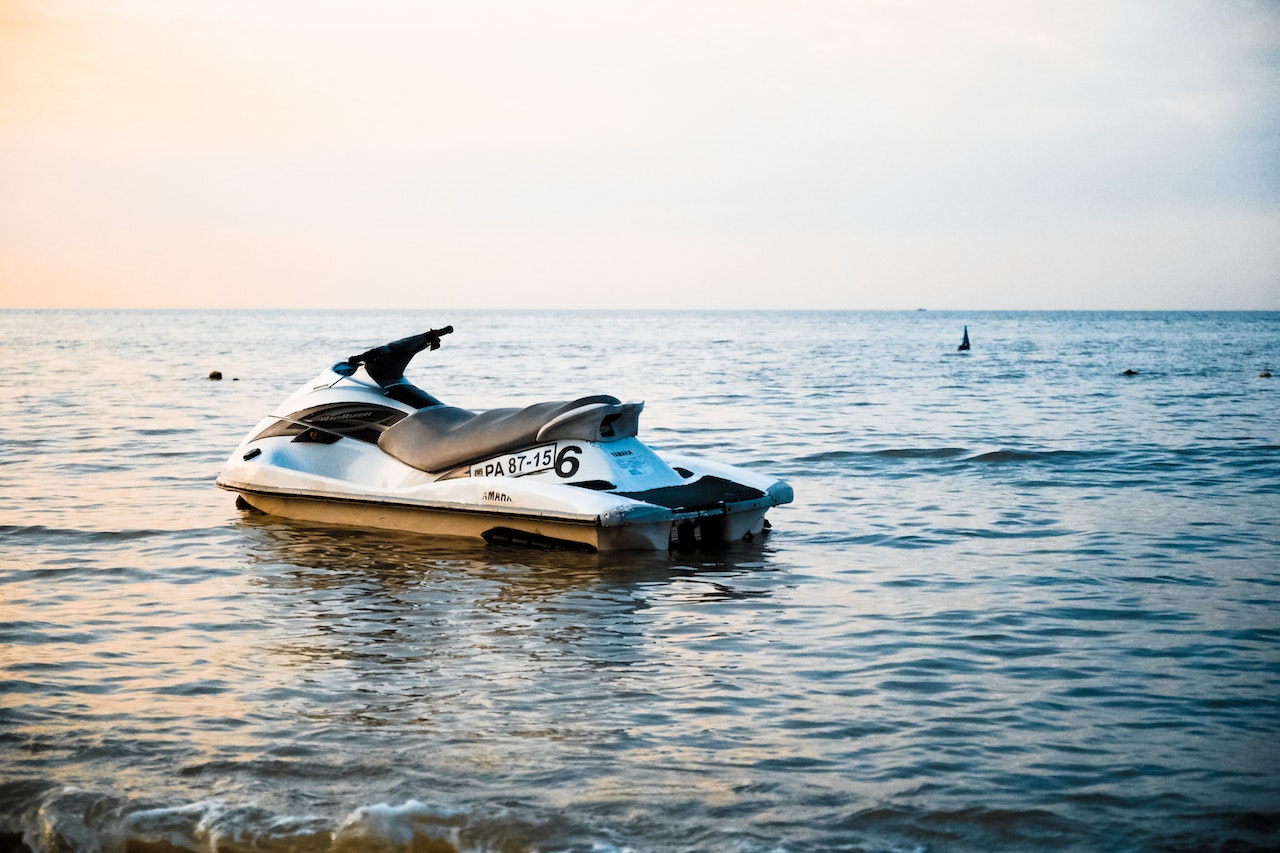 White and Black Personal Watercraft on Body of Water | Veteran Car Donations